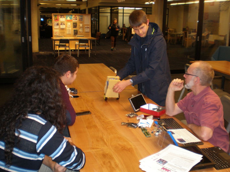 Alex Mous shows off his self-balancing robot to Seattle Raspberry Jam members