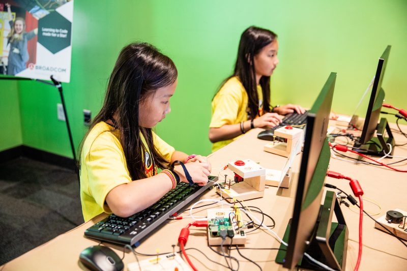 Two girls doing physical computing with Raspberry Pi