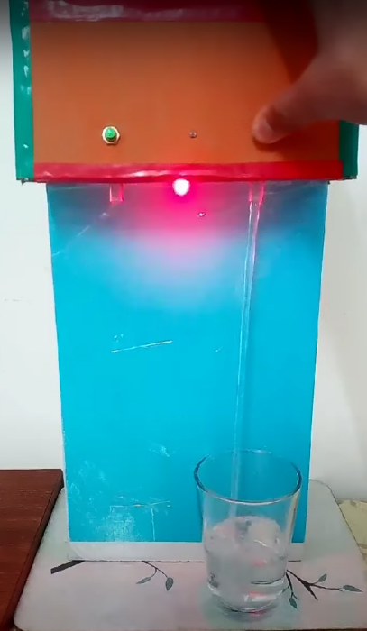 A young person's home-made project to help people get a drink at the press of a button.